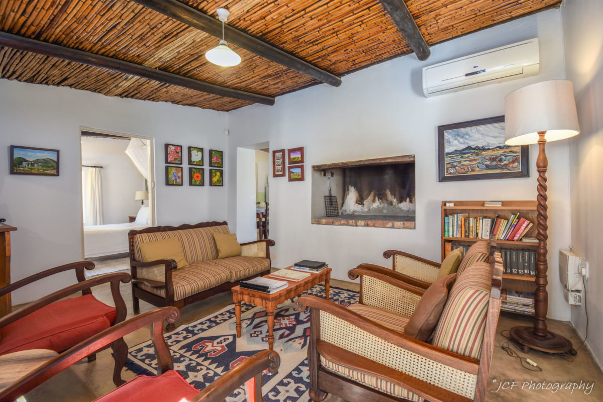 living area and fire place at middelplaas matjiesvlei cottages