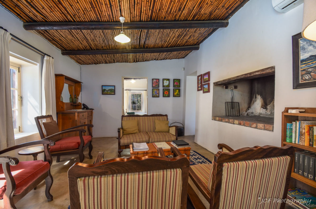 living area and fire place at middelplaas matjiesvlei cottages